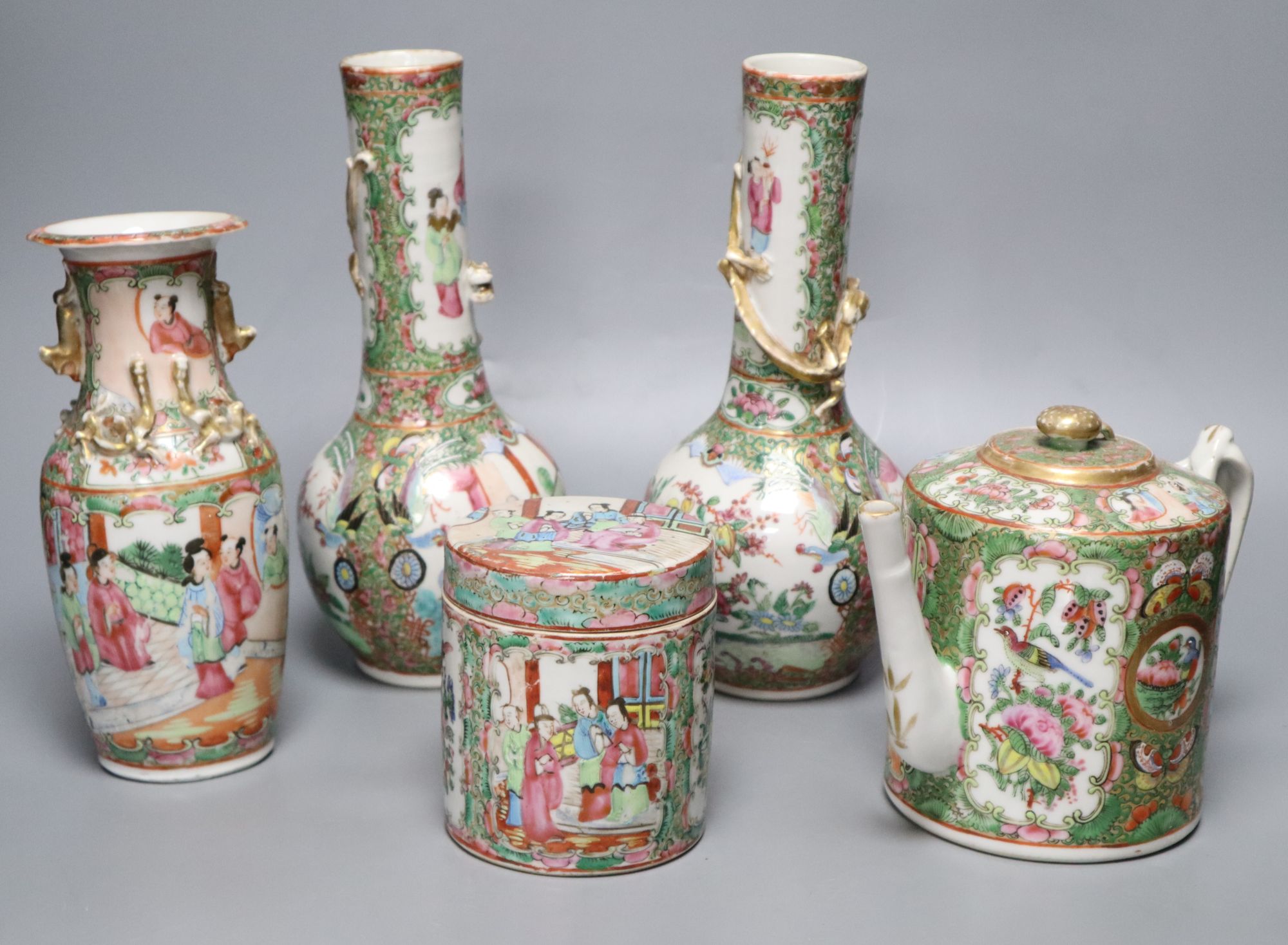 A pair of Chinese famille rose bottle vases, a similar teapot, vase and jar, 19th century, tallest 25cm